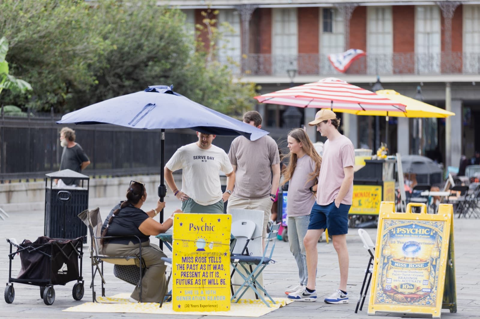 A Serve Day team talking with a street vendor in Jackson Square