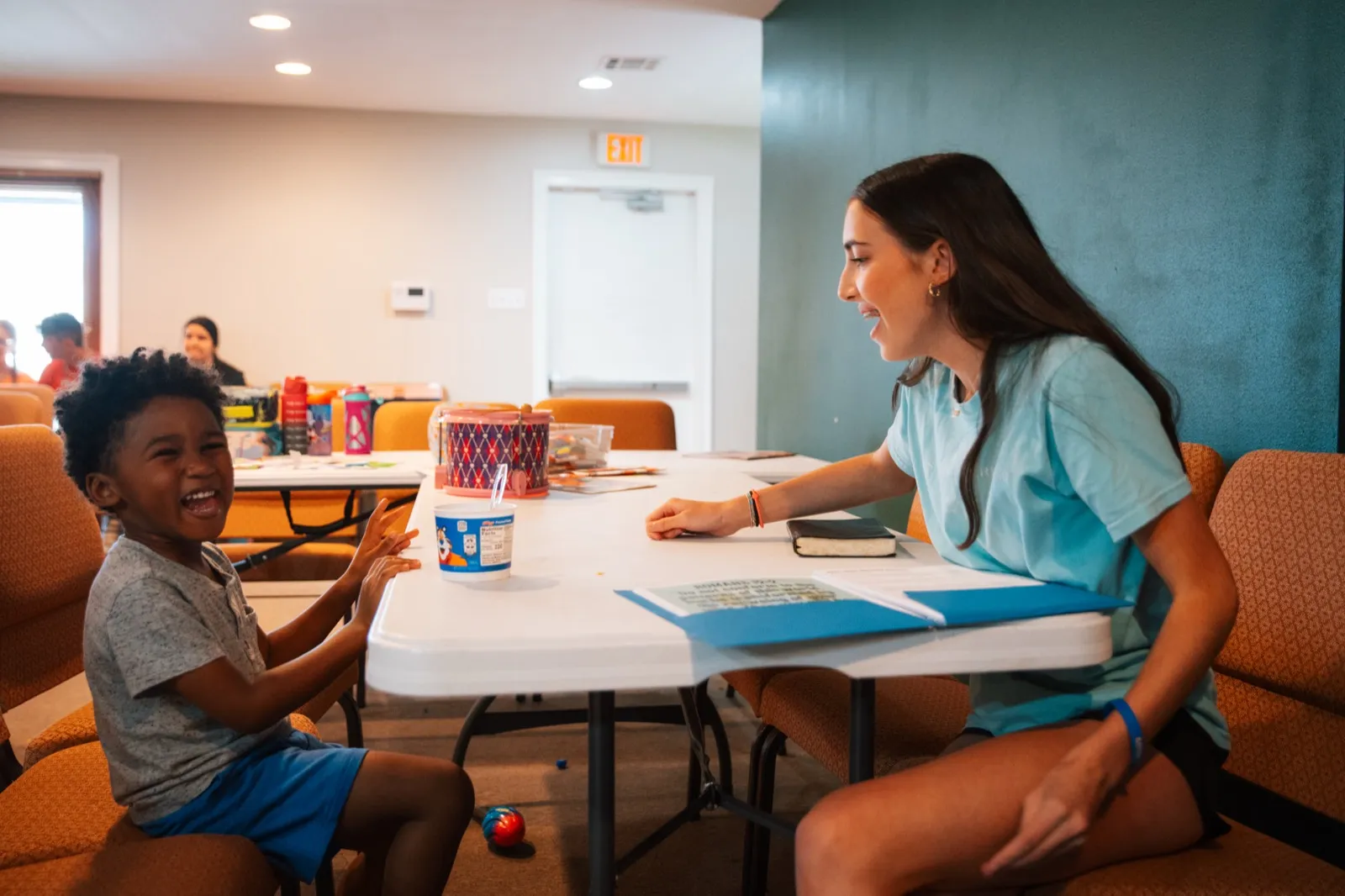 Volunteer talking with a student