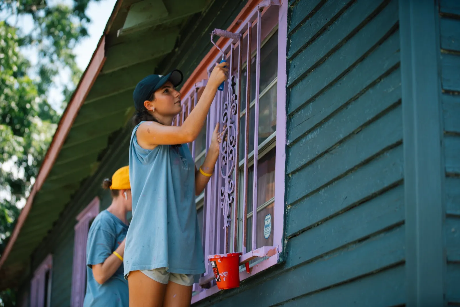 Students painting a house in New Orleans